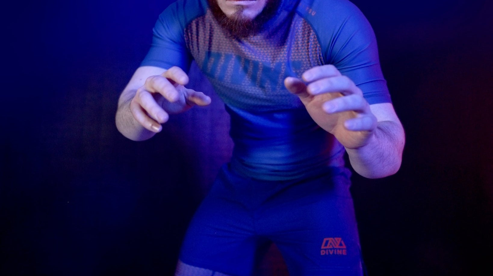 No-gi BJJ rashguard by Divine – illenium Rashguard in blue and orange design for grappling