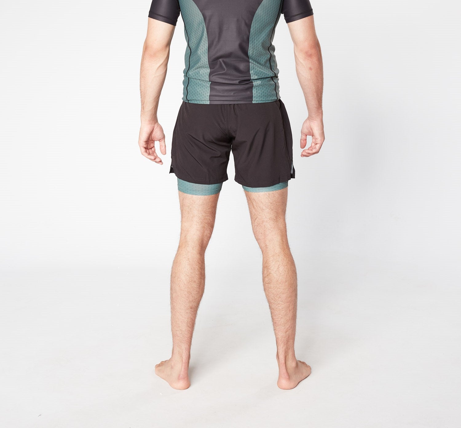 Man in sports shorts and tee standing