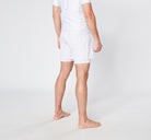 Man in white shorts and t-shirt on white background,