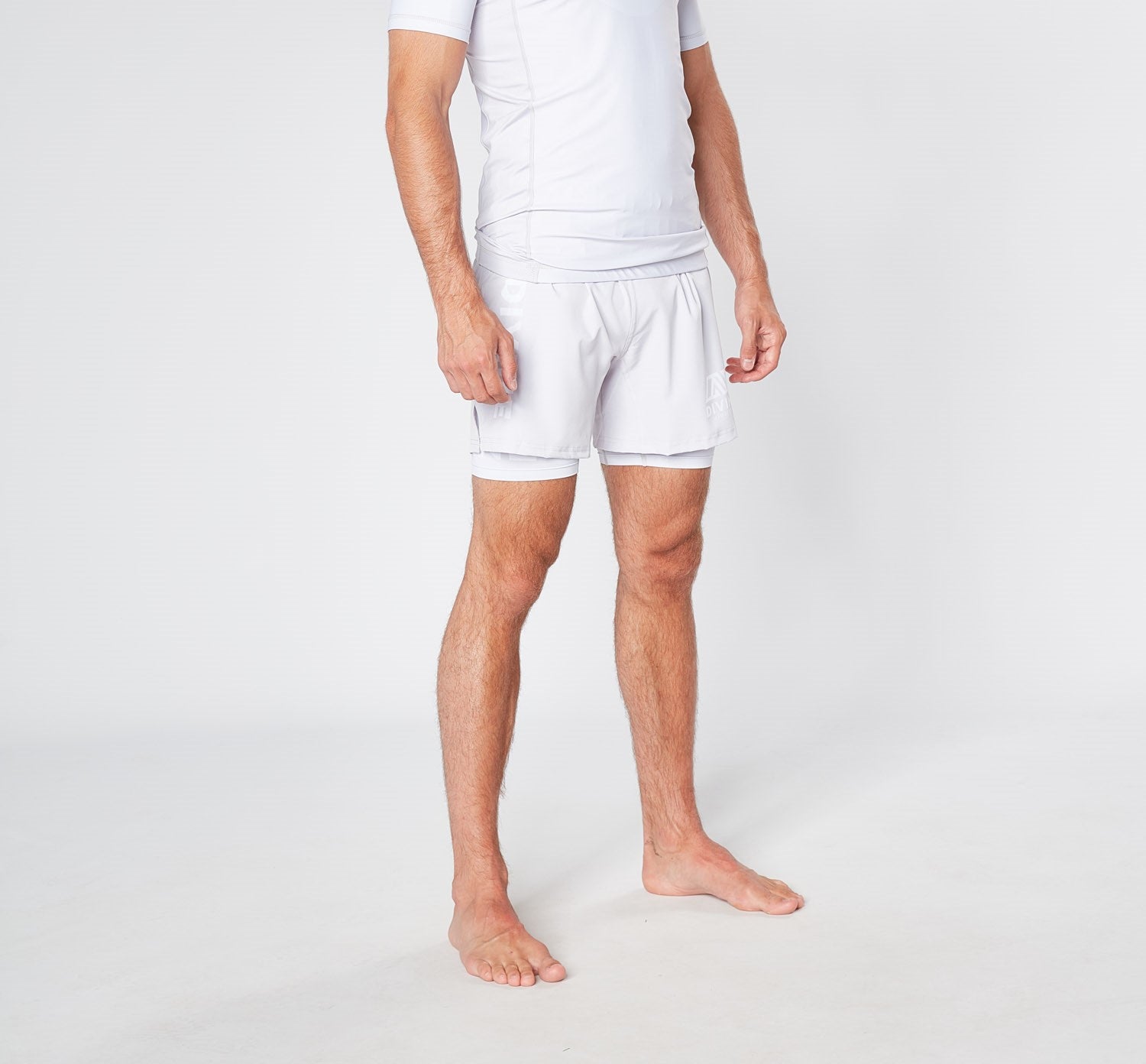 a man wearing a white shorts